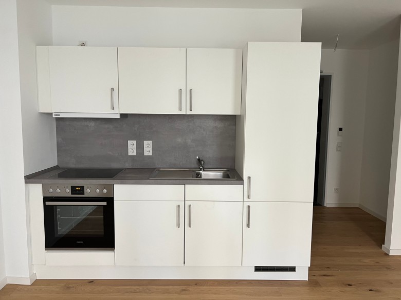1 Zimmer Neubau Apartment mit Einbauküche und Terrasse